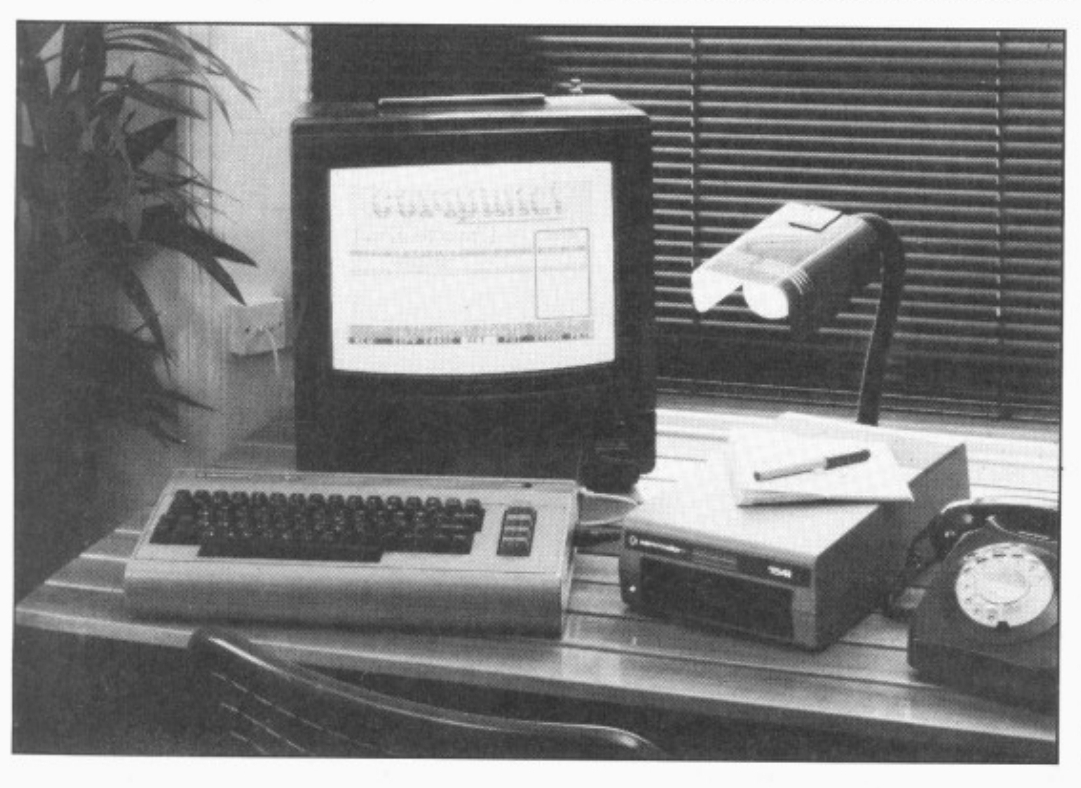 a grainy black and white photo of an old personal computer from the 1980s.